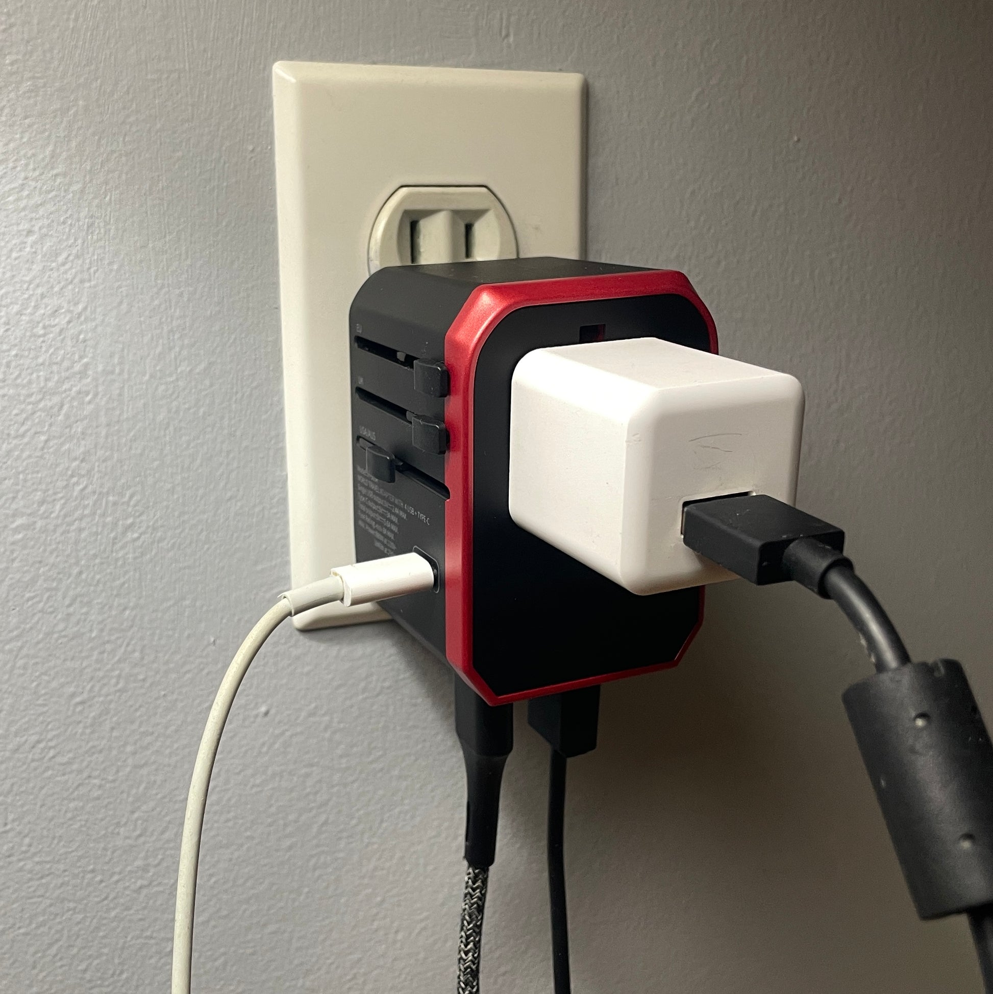 Universal adapter plugged into the wall